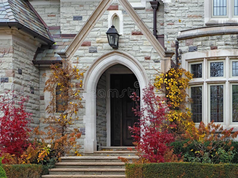 Victorian stone home with arched entrance