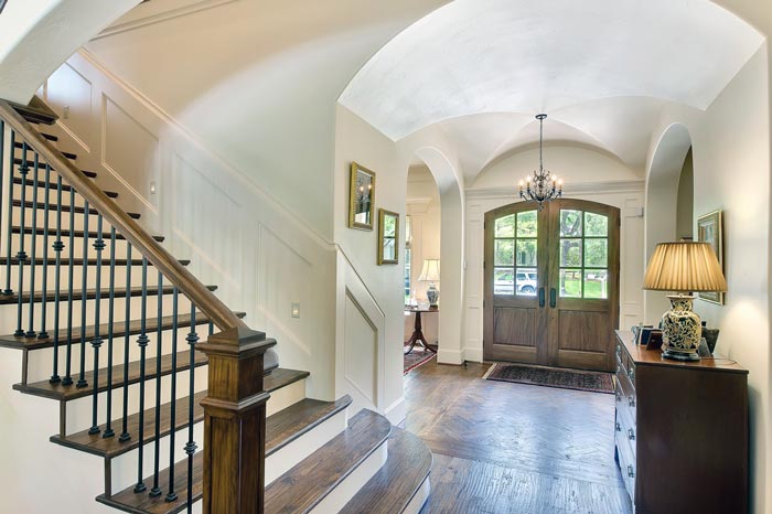 Elegant grand foyer with staircase and heritage architectural details